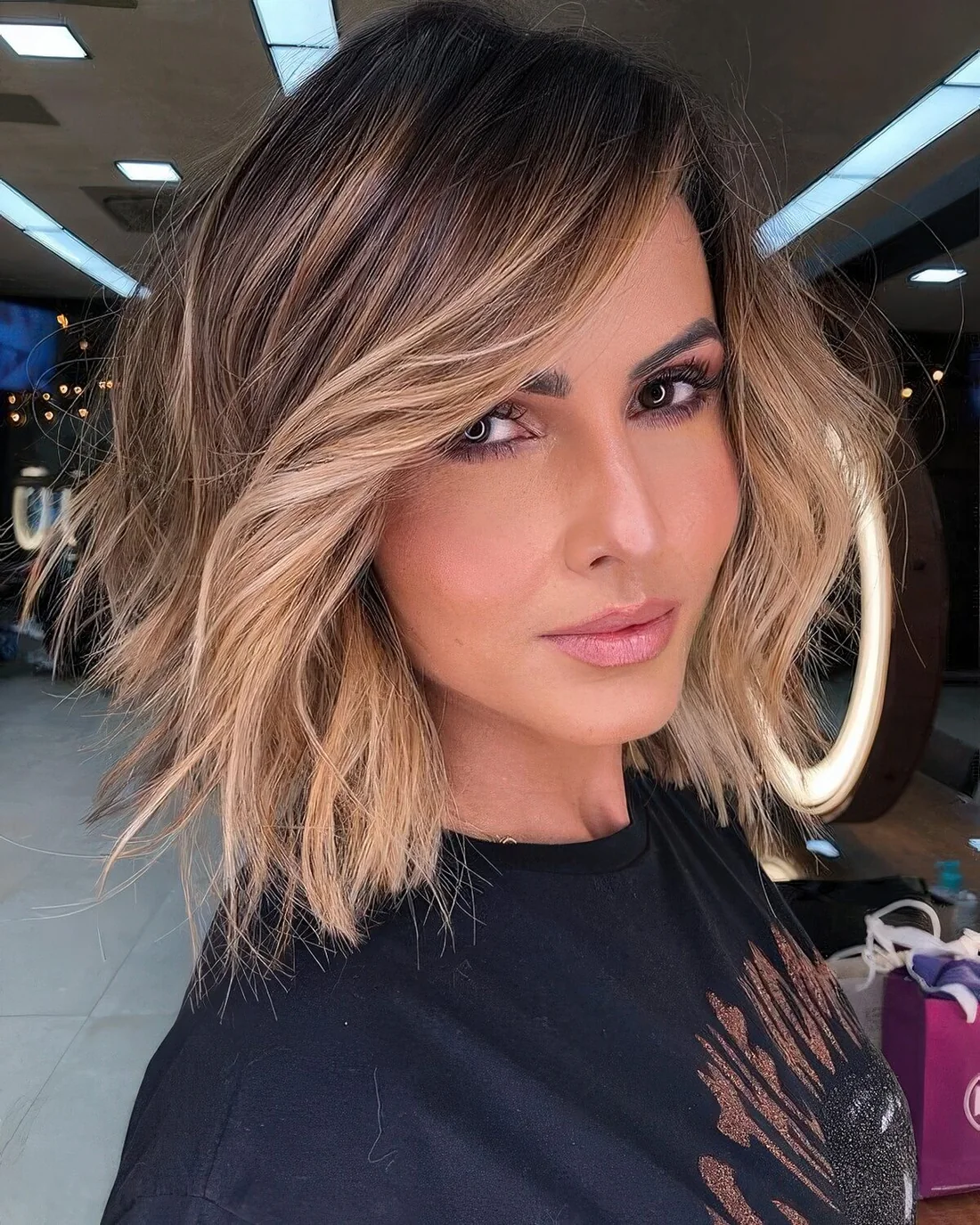 Photo showing chic blonde balayage idea, with the hairstyle clearly visible.