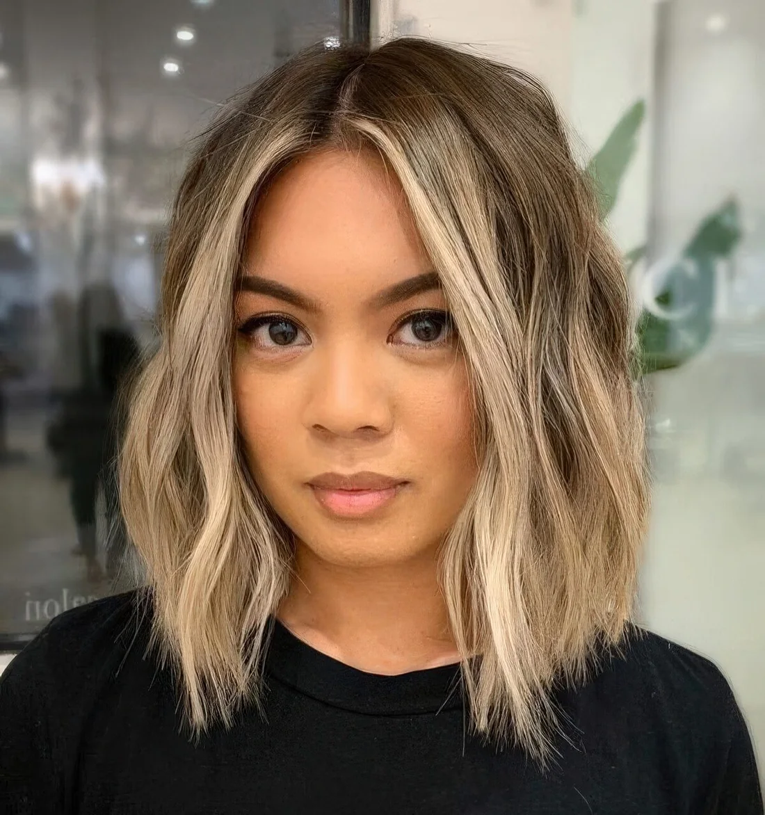 Photo showing long layered bob hairstyle, with the hairstyle clearly visible.