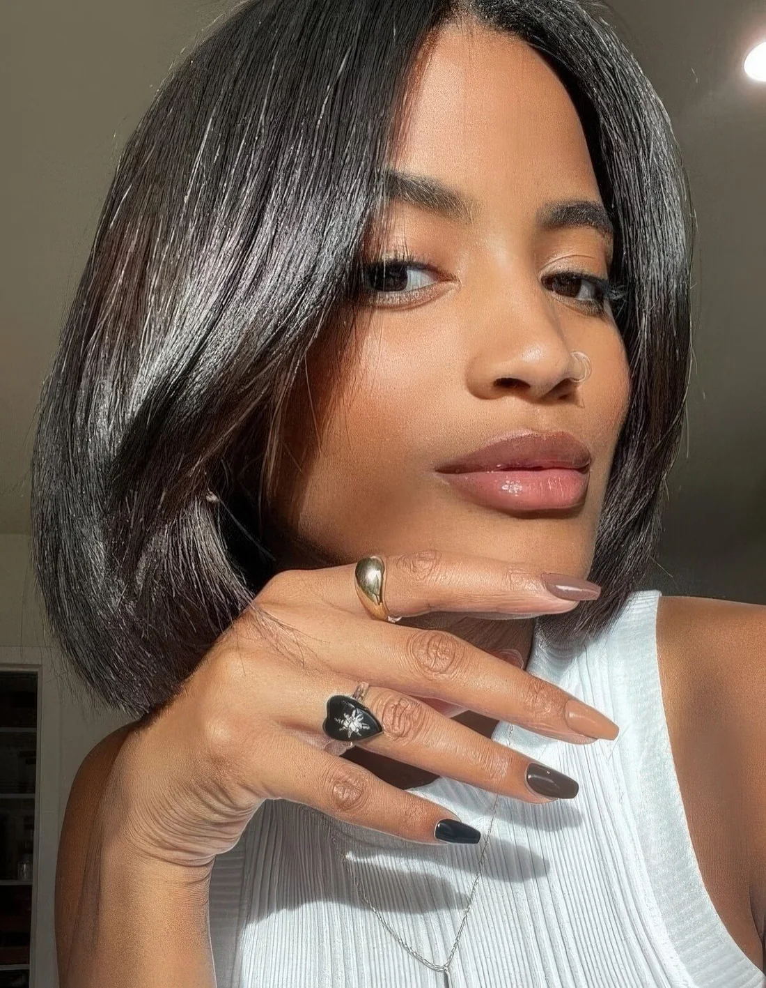 Fab and shiny black liquid bob with curtain bangs.