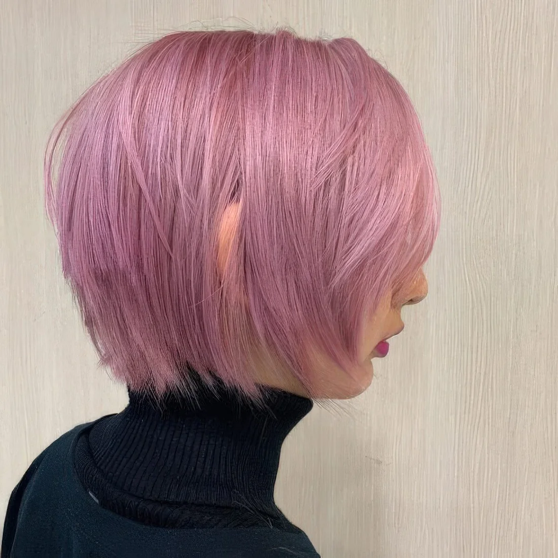 Photo showing pink bob hairstyle, with the hairstyle clearly visible.