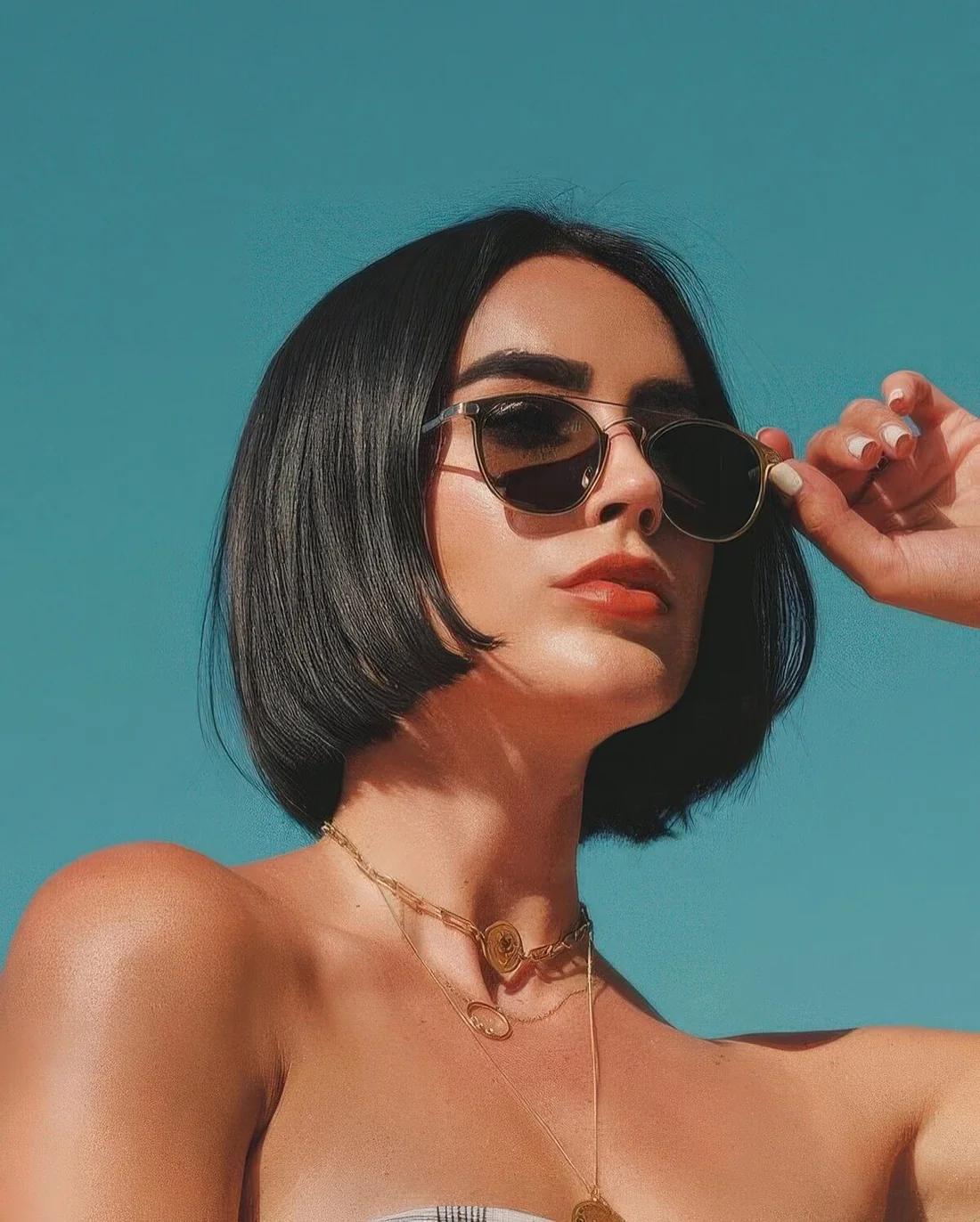 Classic black chin-length bob with center part.