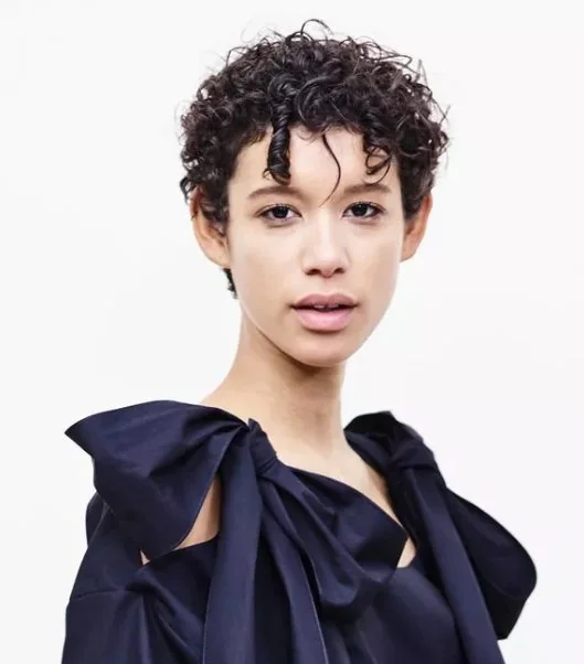 Short pixie with piece y spiral fringe.