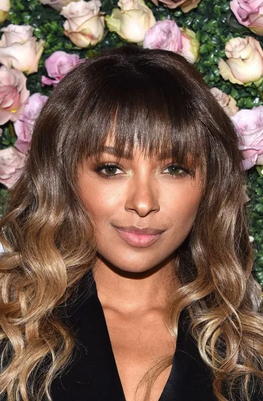Kat Graham's cute, razored fringe with long ombré waves.