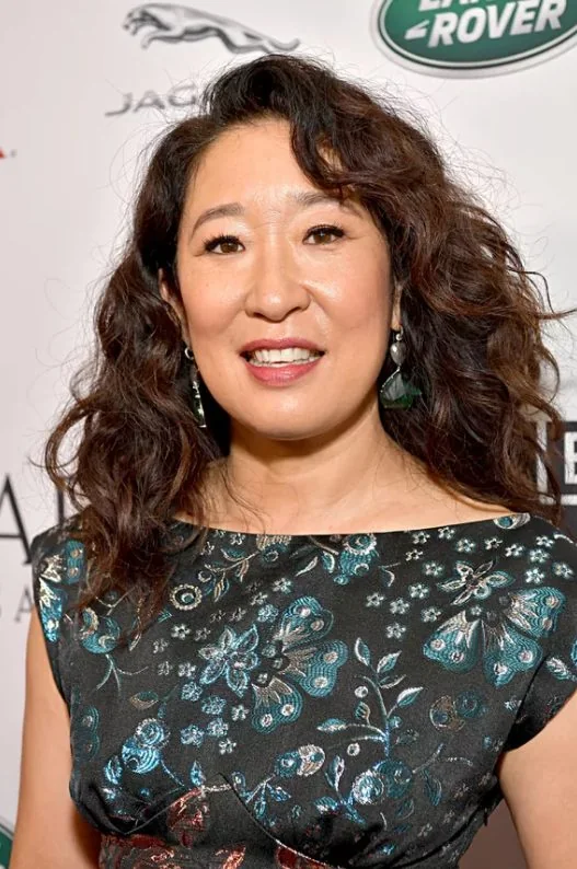 Photo showing side swept bangs, like Sandra Oh, with the hairstyle clearly visible.