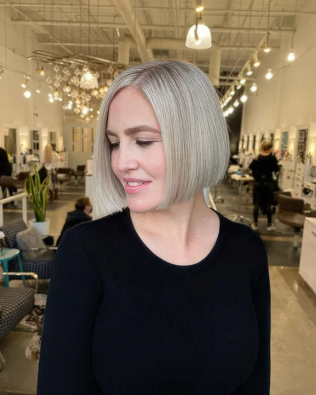 Platinum chin-length bob with side part.