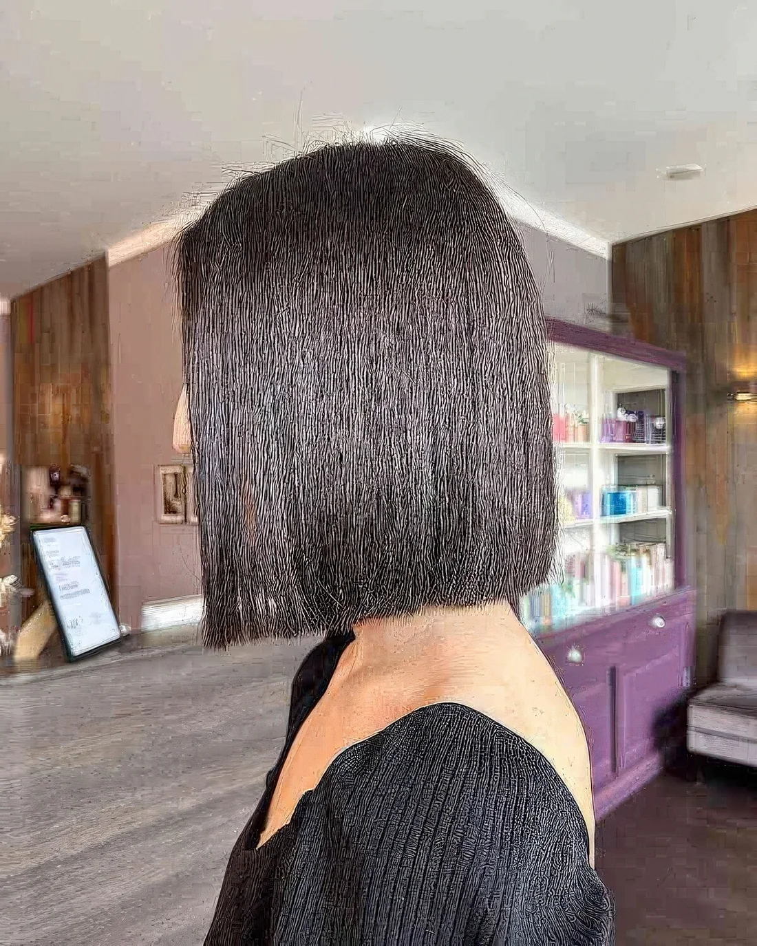 Neck-length haircut with blunt ends.