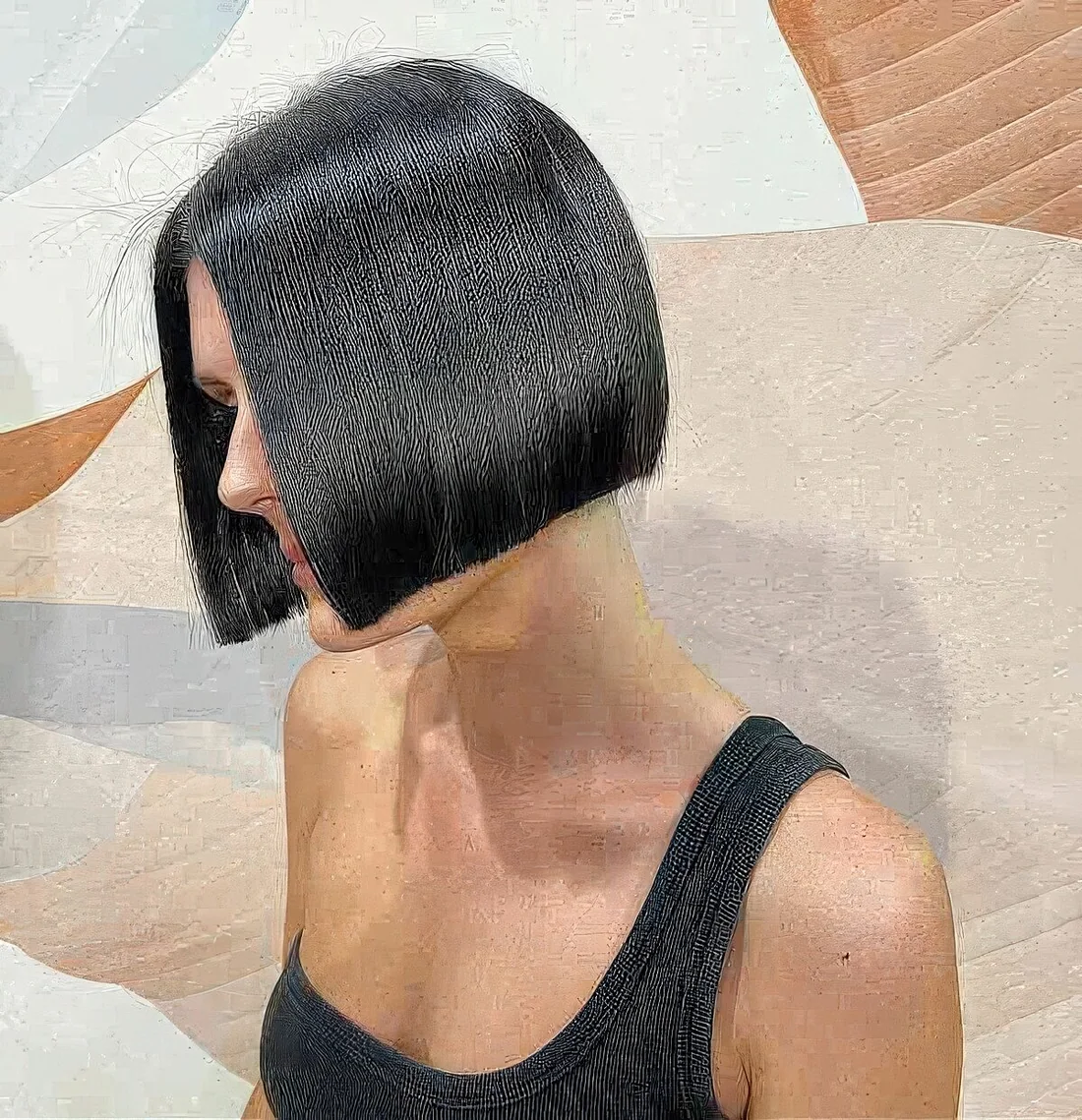 Shiny black jaw-length bob creates a highly desifned look with crisp lines and.
