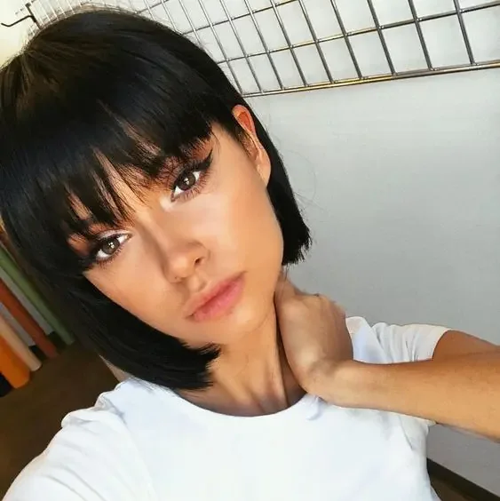 Black boy bob with bangs for a super cute, doll like look.