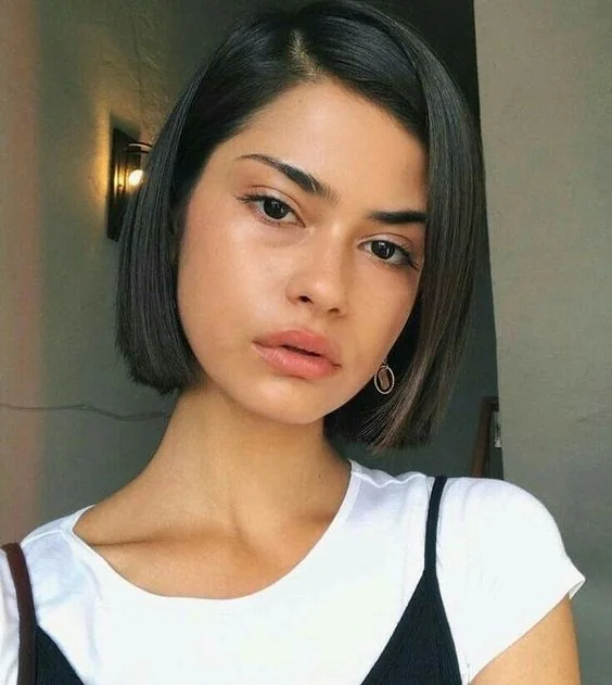 Sleek and shiny boy bob with side part.