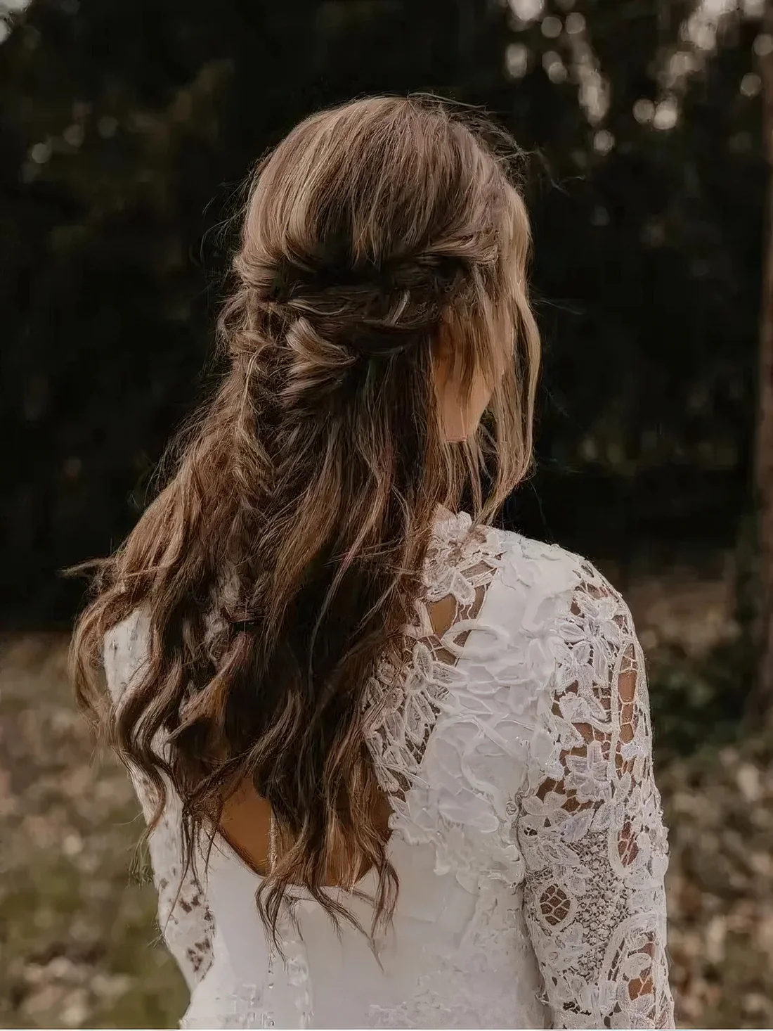 Boho half updo with a double braided halo and a fishtail braid and waves down.