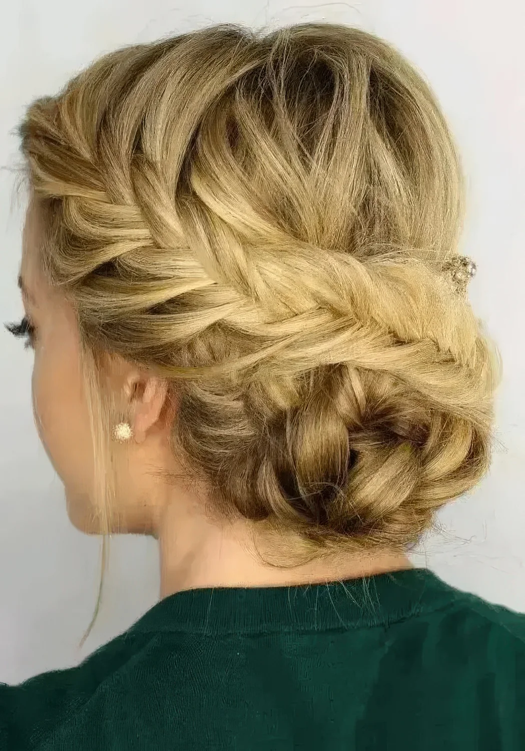Fishtail side braided updo with a braided bun and some locks down.