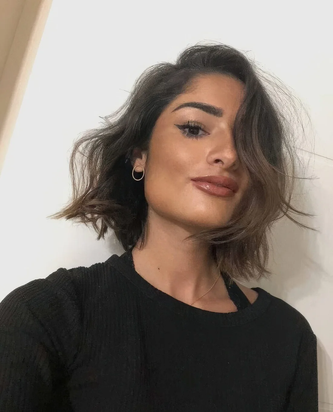 Bring a bit of breezy mess to your elegant bob with waves and messy texture.