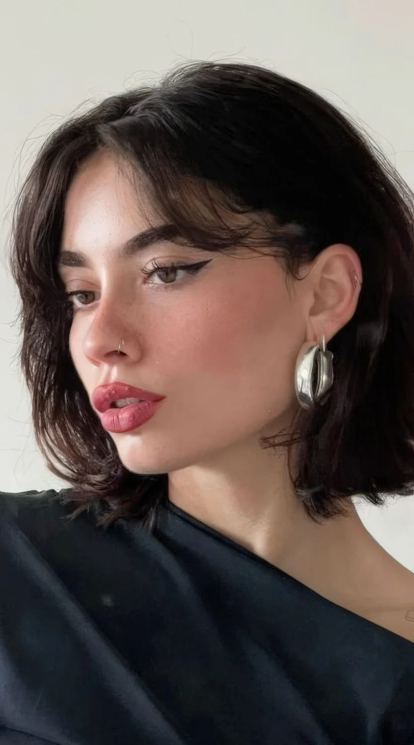 Photo showing short curtain bangs, with the hairstyle clearly visible.