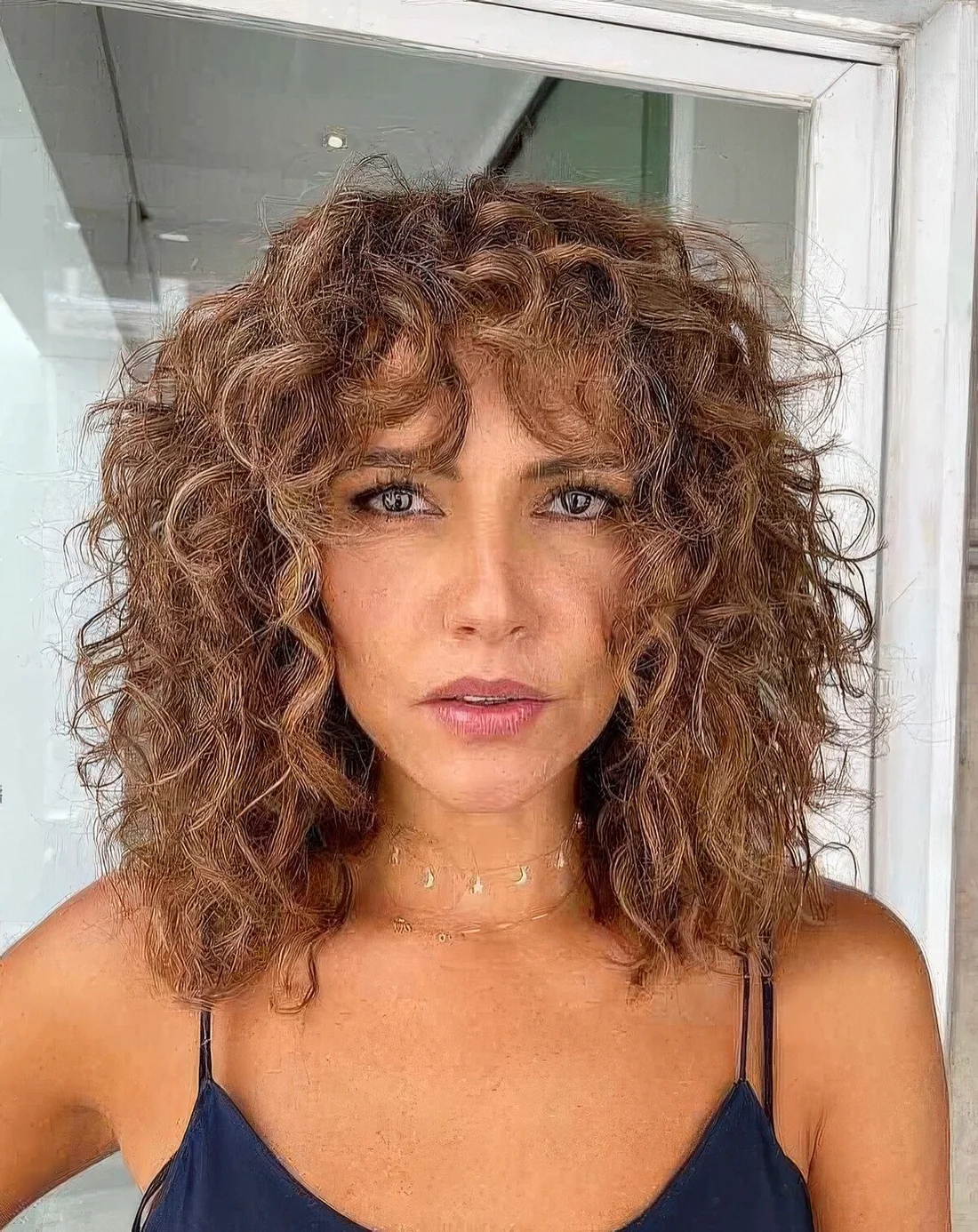 Boho curly lob with shorter layers going into a shaggy curly bob for some texture for more flattering loioks.