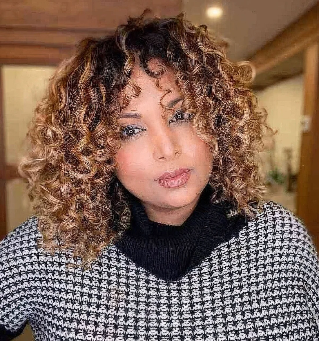 Photo showing curly bob hairstyle, with the hairstyle clearly visible.