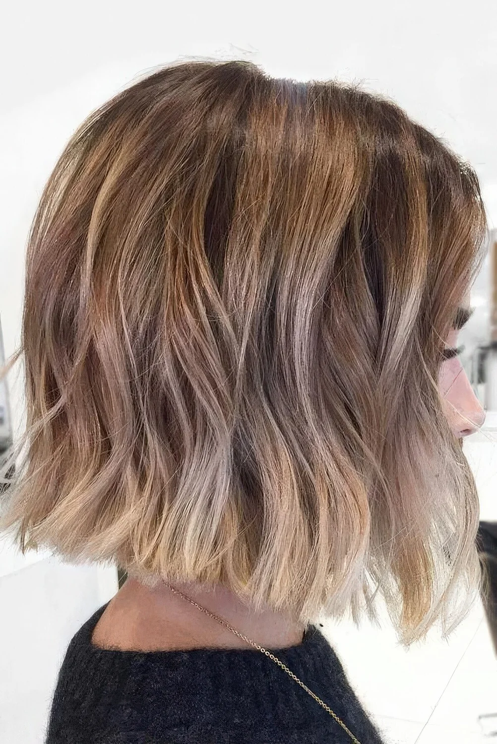 Midi bronde bob with caramel highlights and bleached ends plus waves.