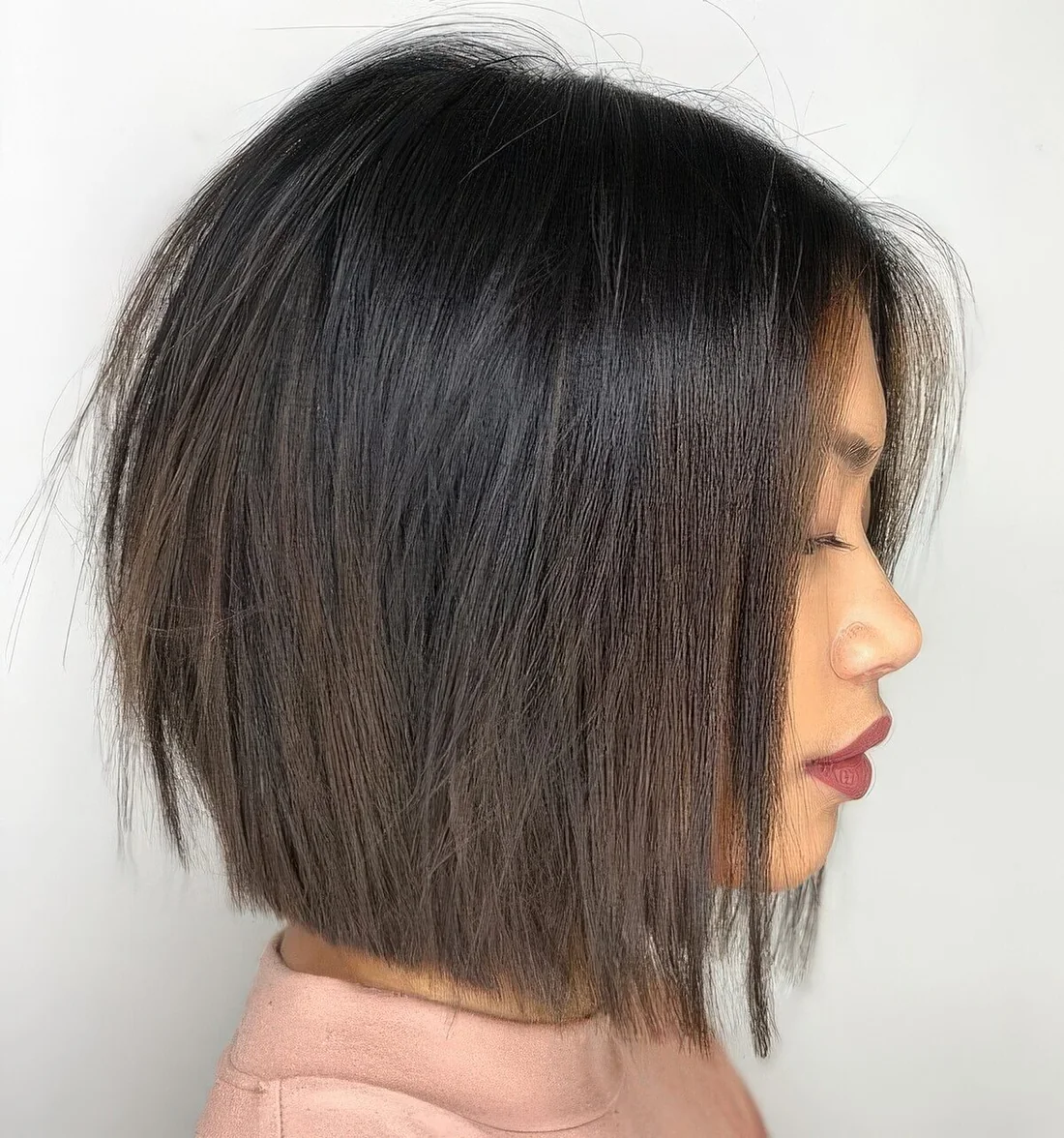 Dark brunette midi bob with volume and texture.