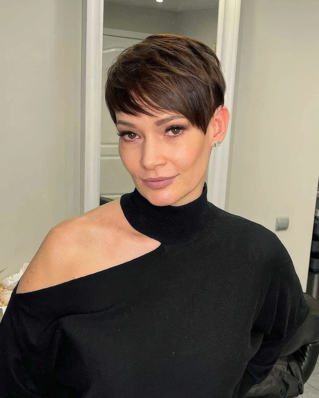 Photo showing short layered pixie haircut, with the hairstyle clearly visible.