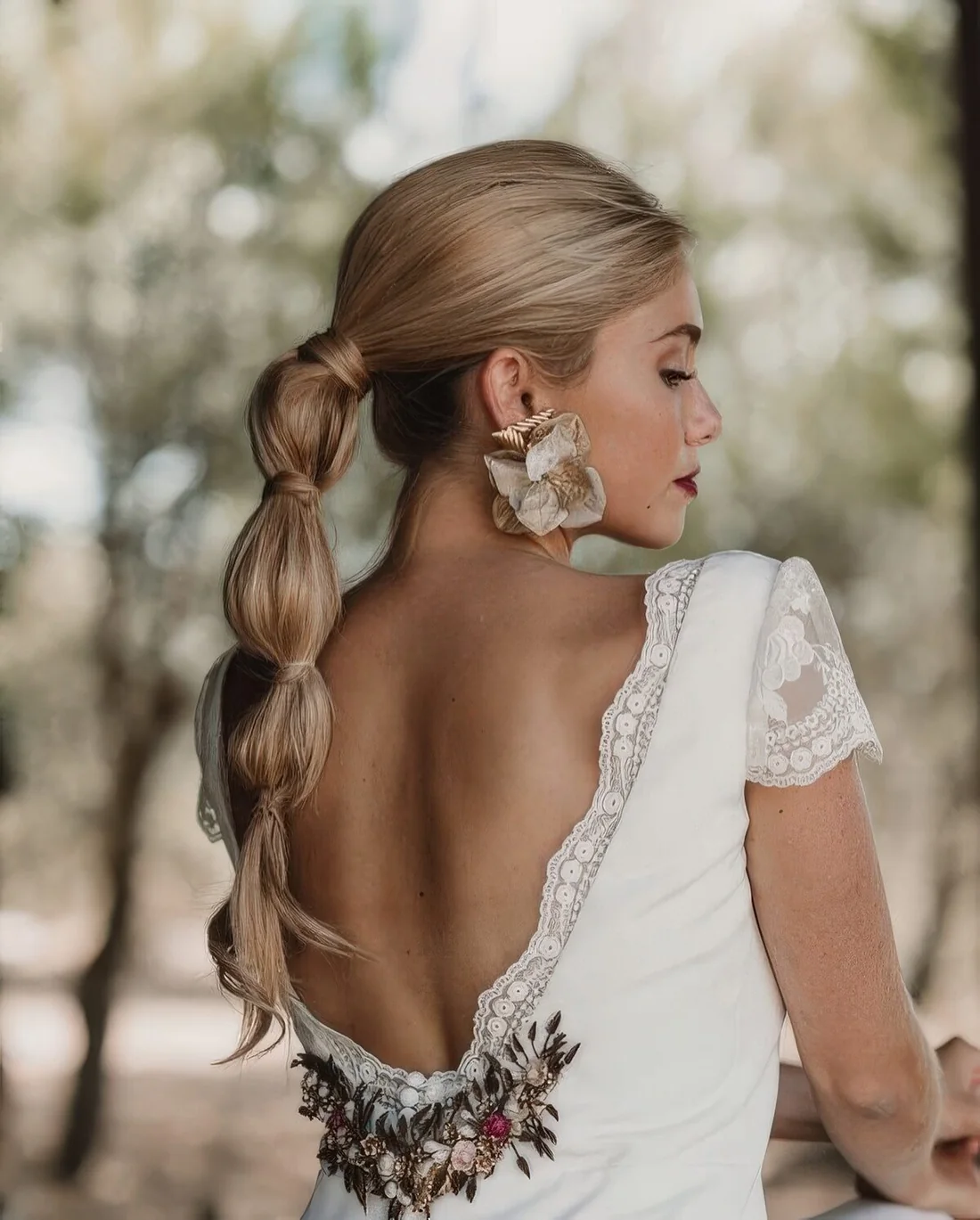 Modern wedding hairstyle, a midi bubble braid with a volume on top.