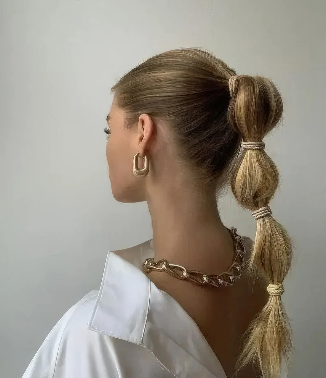 Photo showing high bubble braid, with the hairstyle clearly visible.