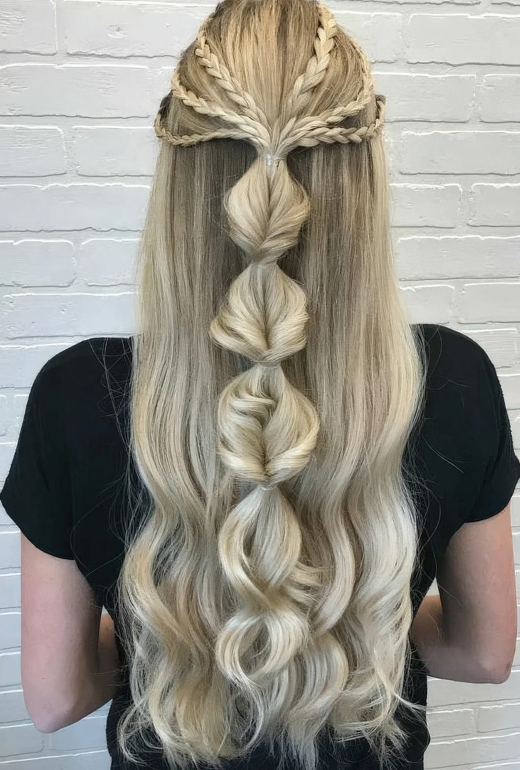 Photo showing creative half updo, with the hairstyle clearly visible.