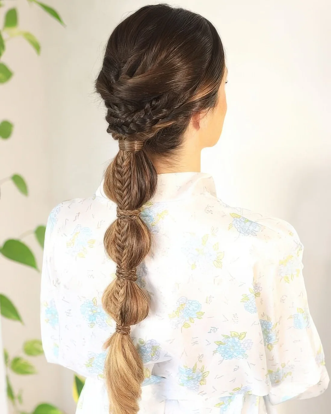 Wedding hairstyle with a braided halo, a bubble plus fishtail braid and a volume on top.
