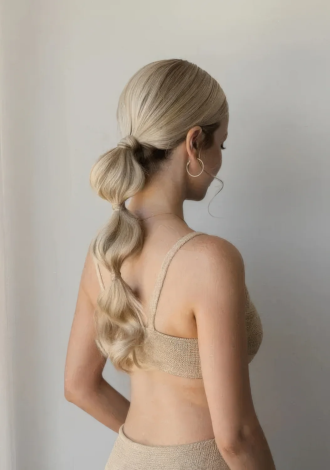 Photo showing low bubble ponytail, with the hairstyle clearly visible.
