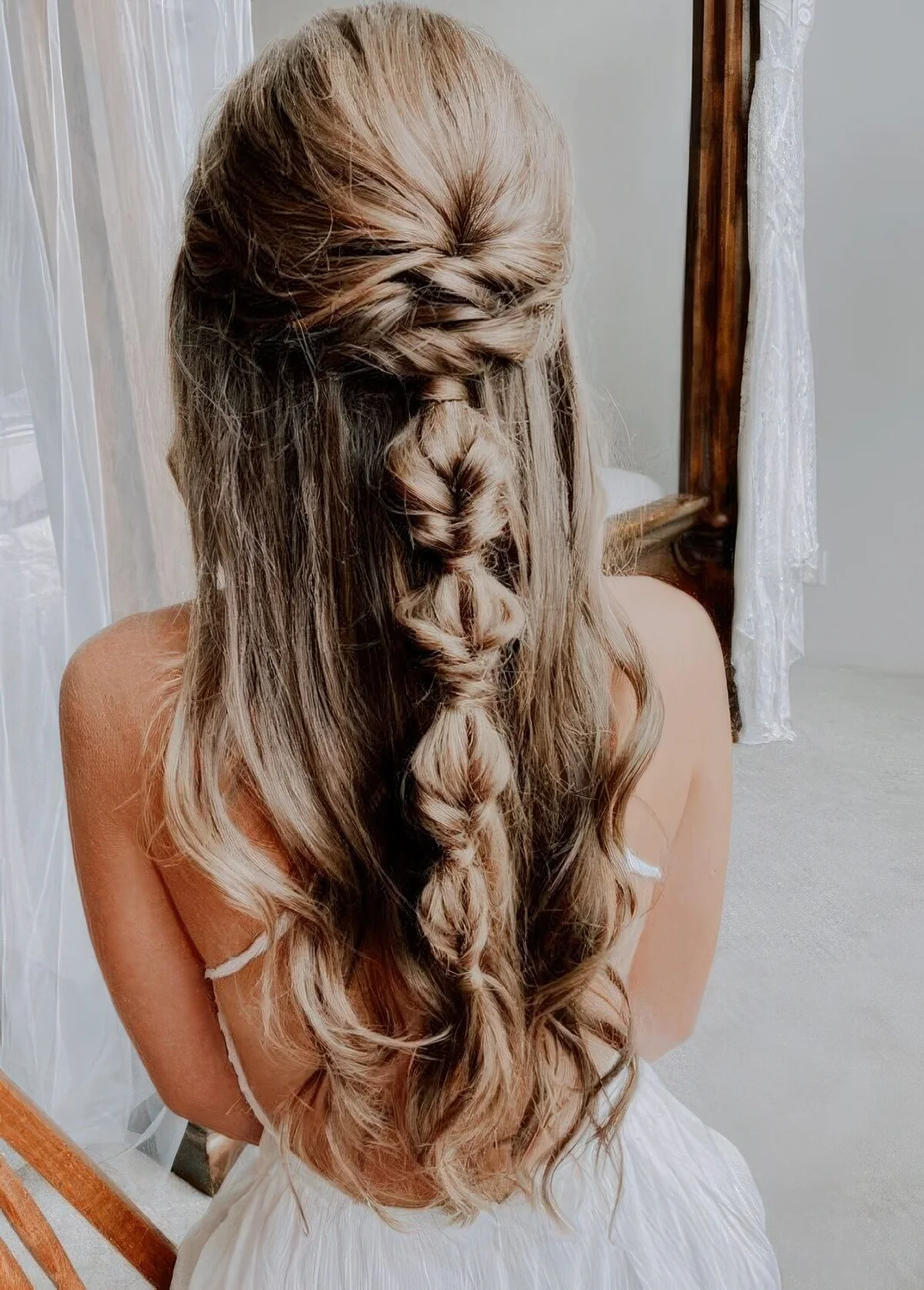Photo showing messy boho hairstyle, with the hairstyle clearly visible.