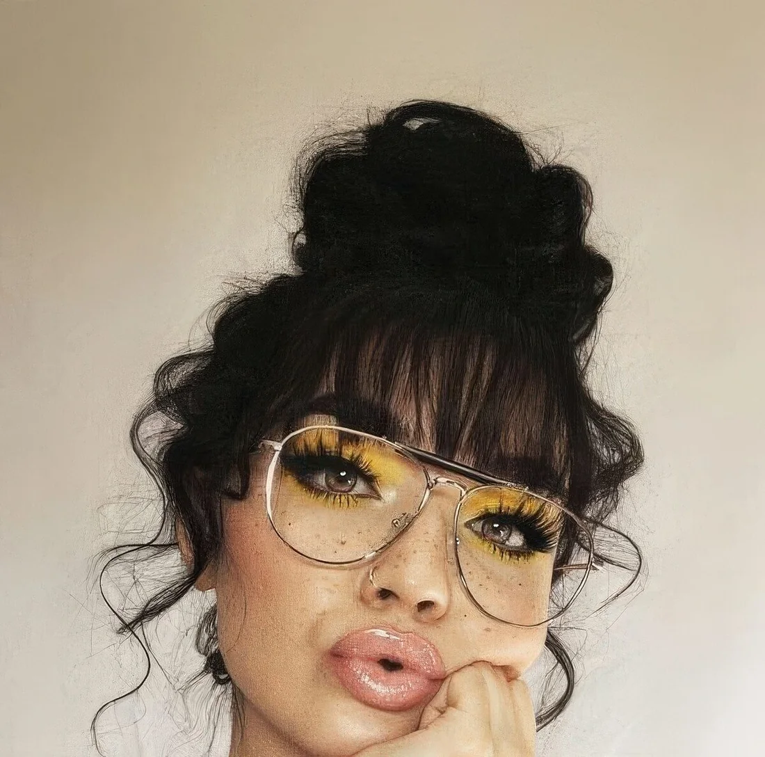 Wavy top knot with a classic fringe and waves down.