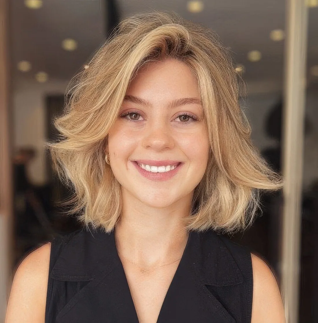 Photo showing blonde bob hairstyle, with the hairstyle clearly visible.