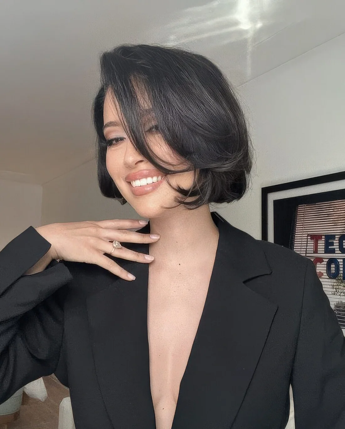 Sophisticated black butterfly bob featuring some layers and some volume.