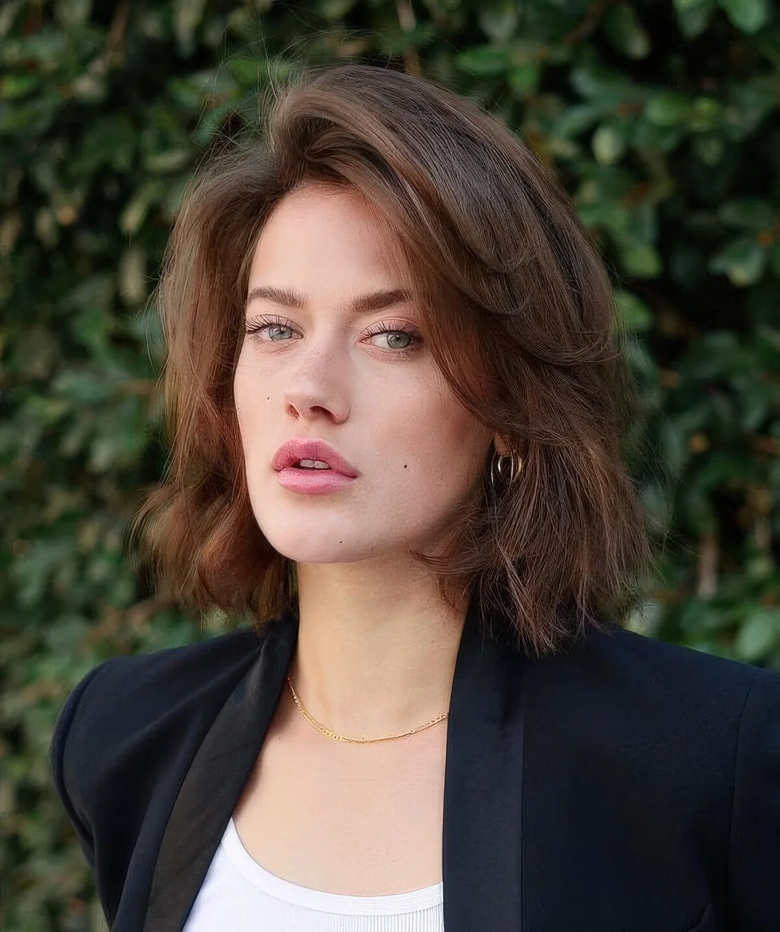 Try a 90s inspired look with a butterfly bob and layers with curled ends, with a lot of volume.