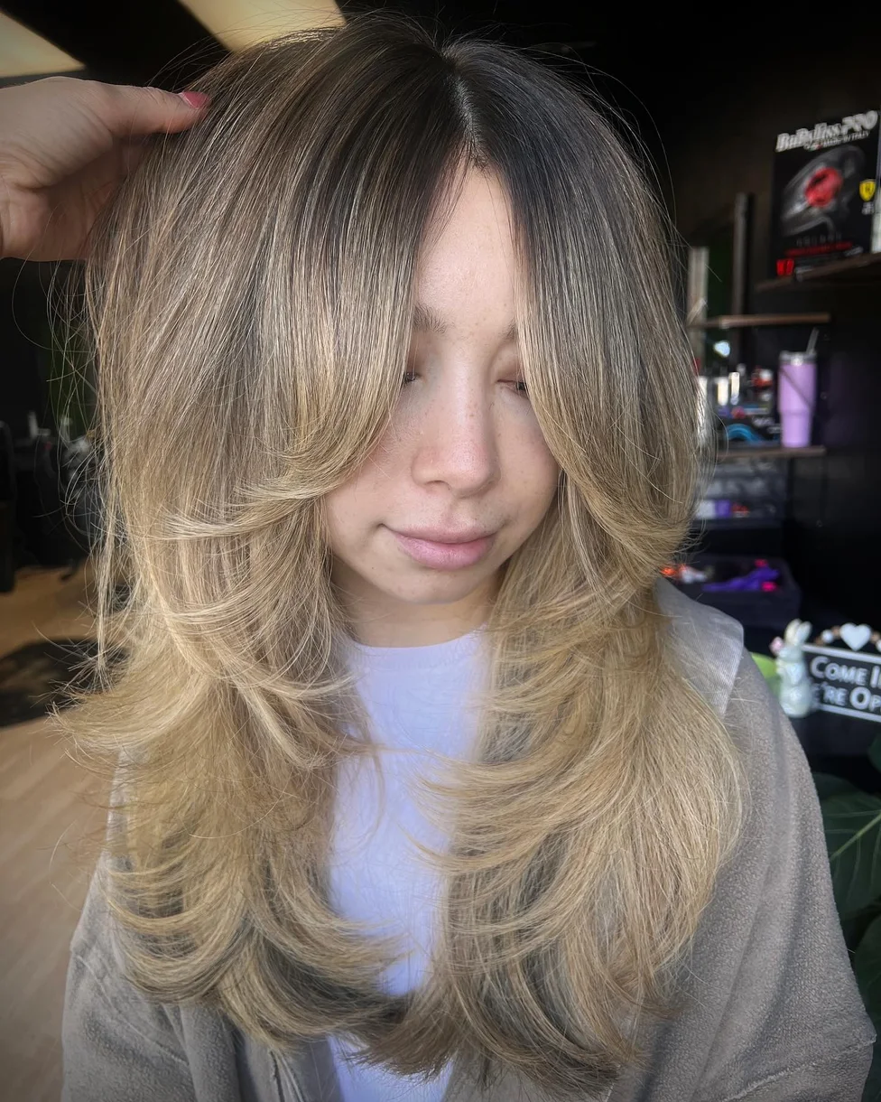 chest straight blonde layers with curtain fringe shown as a butterfly haircut long hairs idea