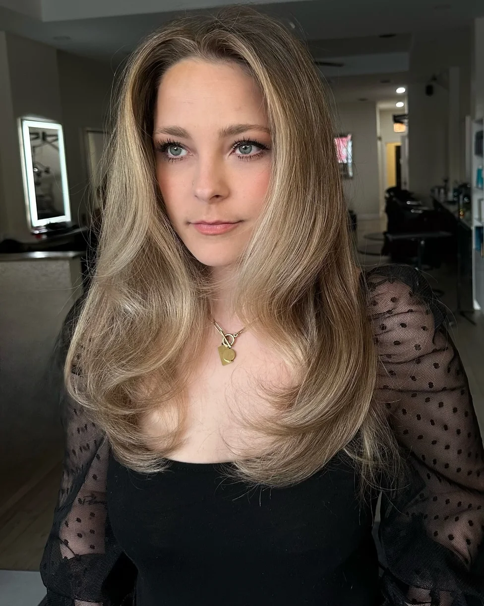 chest wavy honey layers shown as a butterfly haircut long hairs idea, featuring honey color