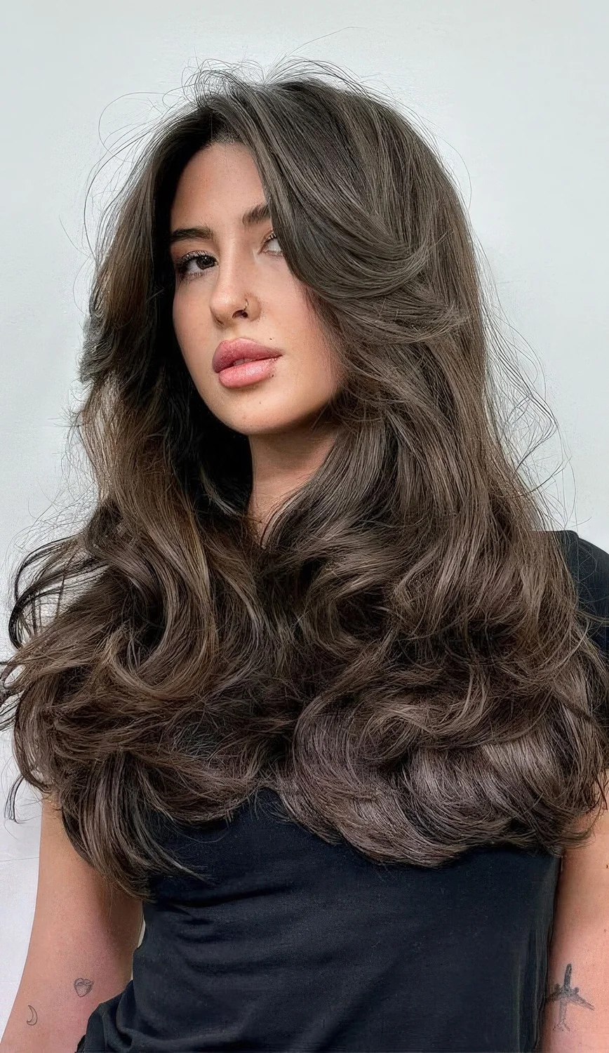 Photo showing long hairstyle with curtain bangs, with the hairstyle clearly visible.