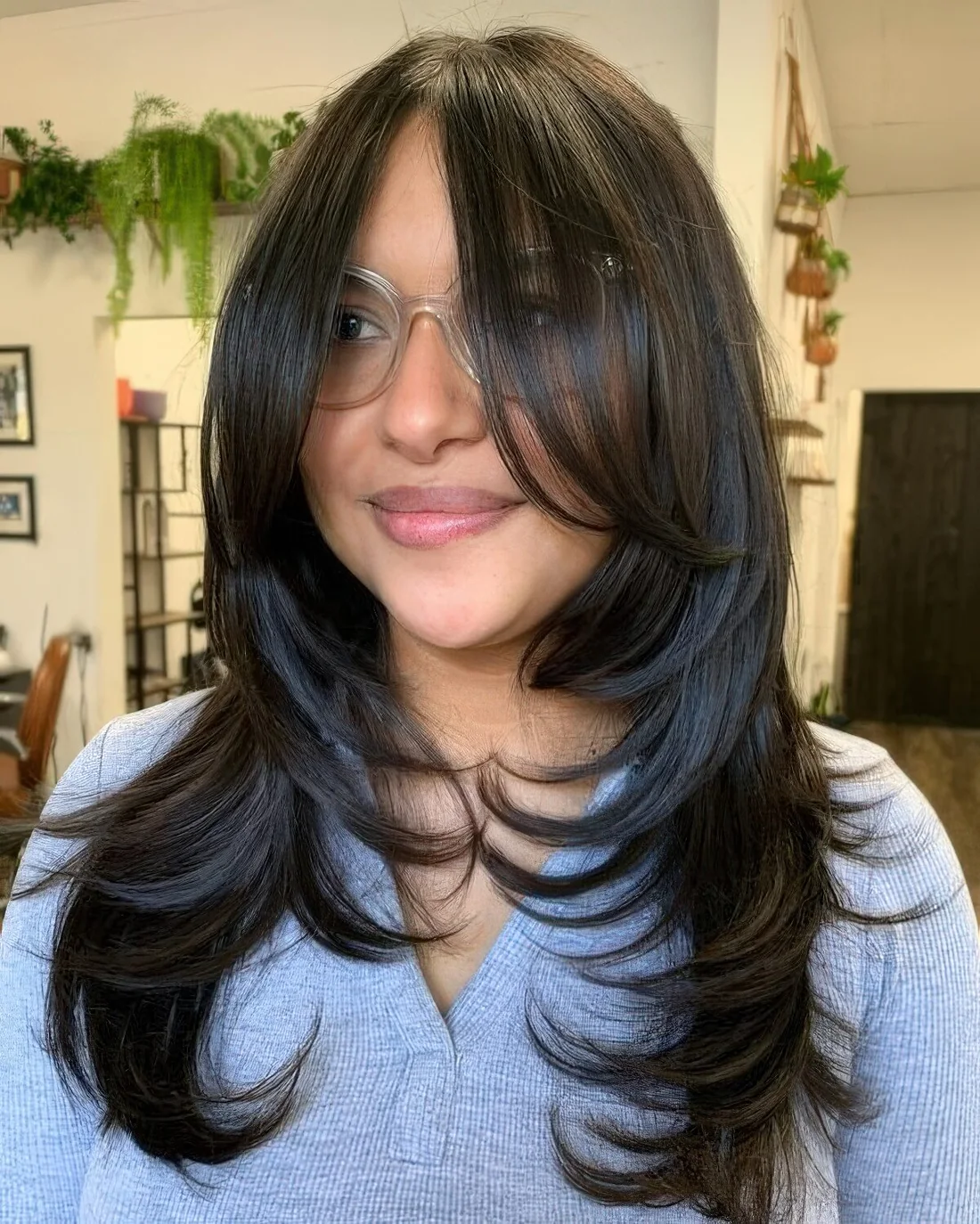 Long hairstyle with bottleneck bangs.