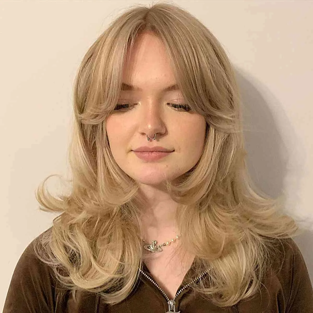 chest wavy honey layers with curtain fringe shown as a butterfly haircuts with bangs idea