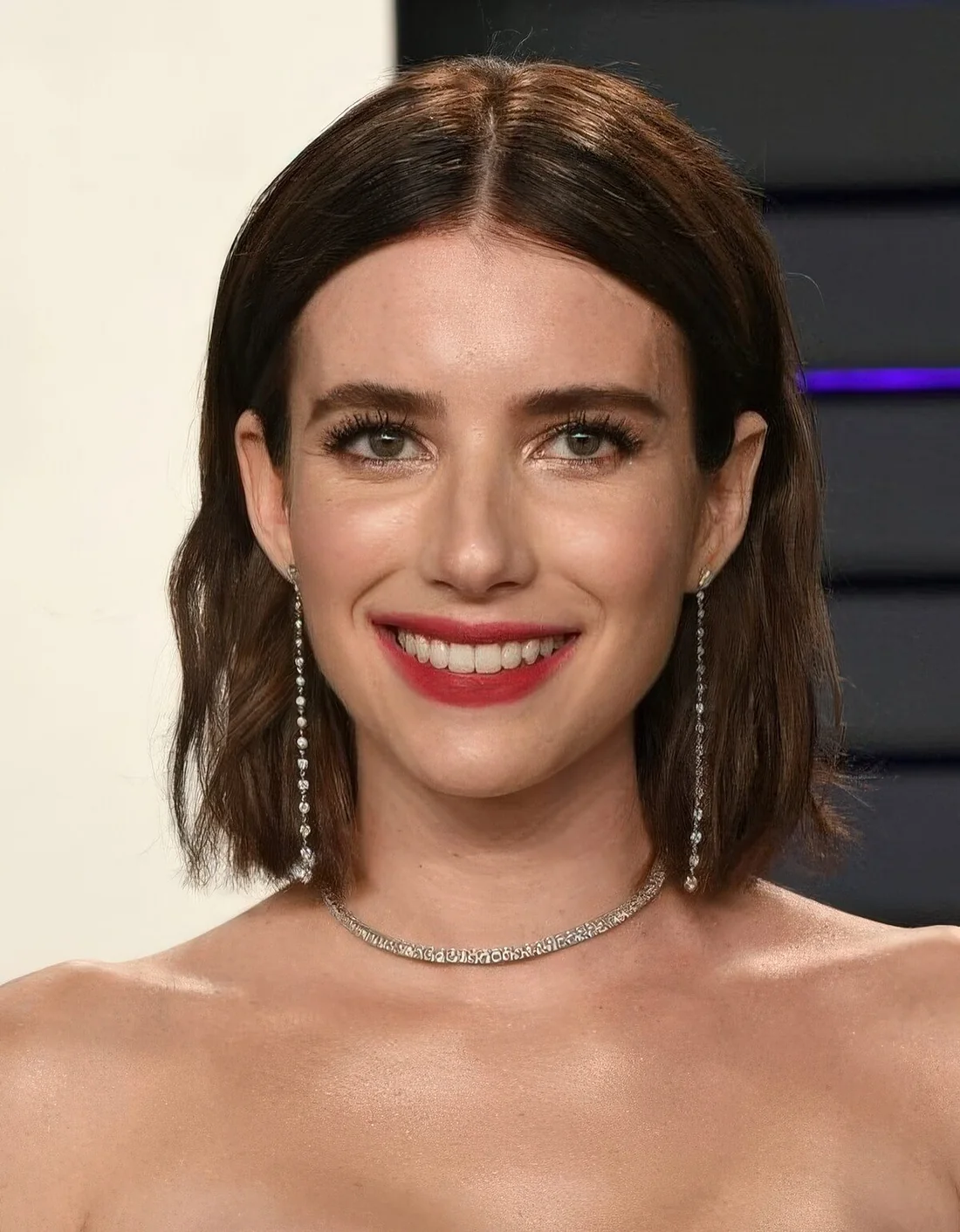 Dark brunette wavy long bob with middle part.