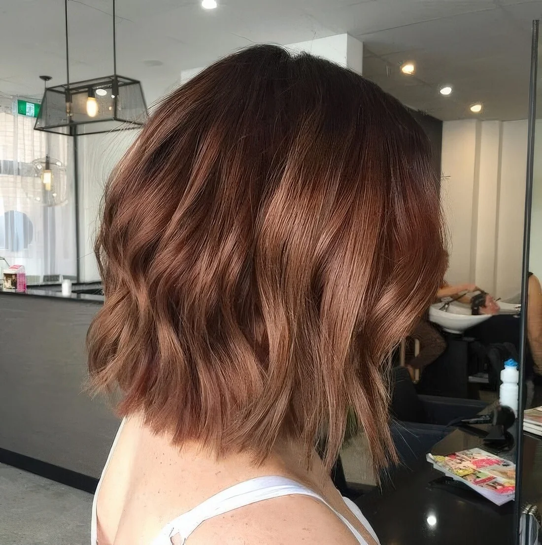 Long chestnut bob with slight waves.