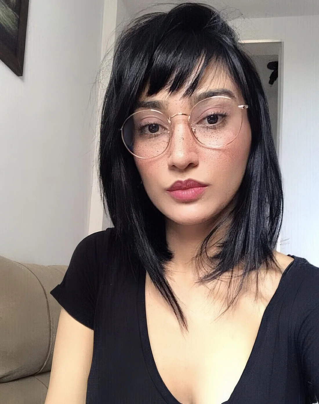 Long black bob with a classic fringe.