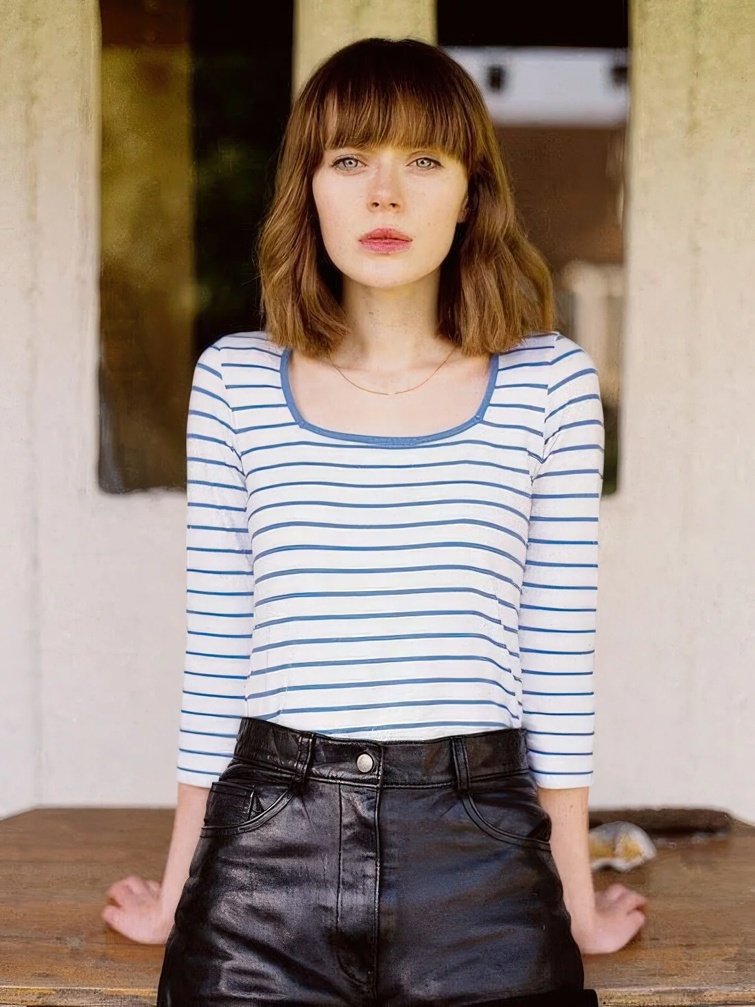Long brown bob with a classic fringe and a bit of messy texture.