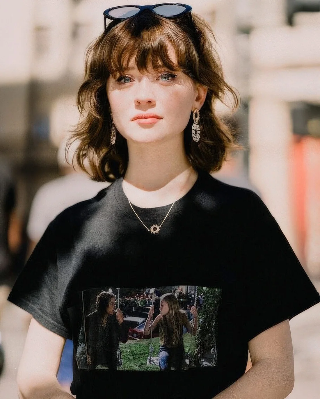 Long wavy bob in dark brunette, with a classic outgrown fringe and waves.