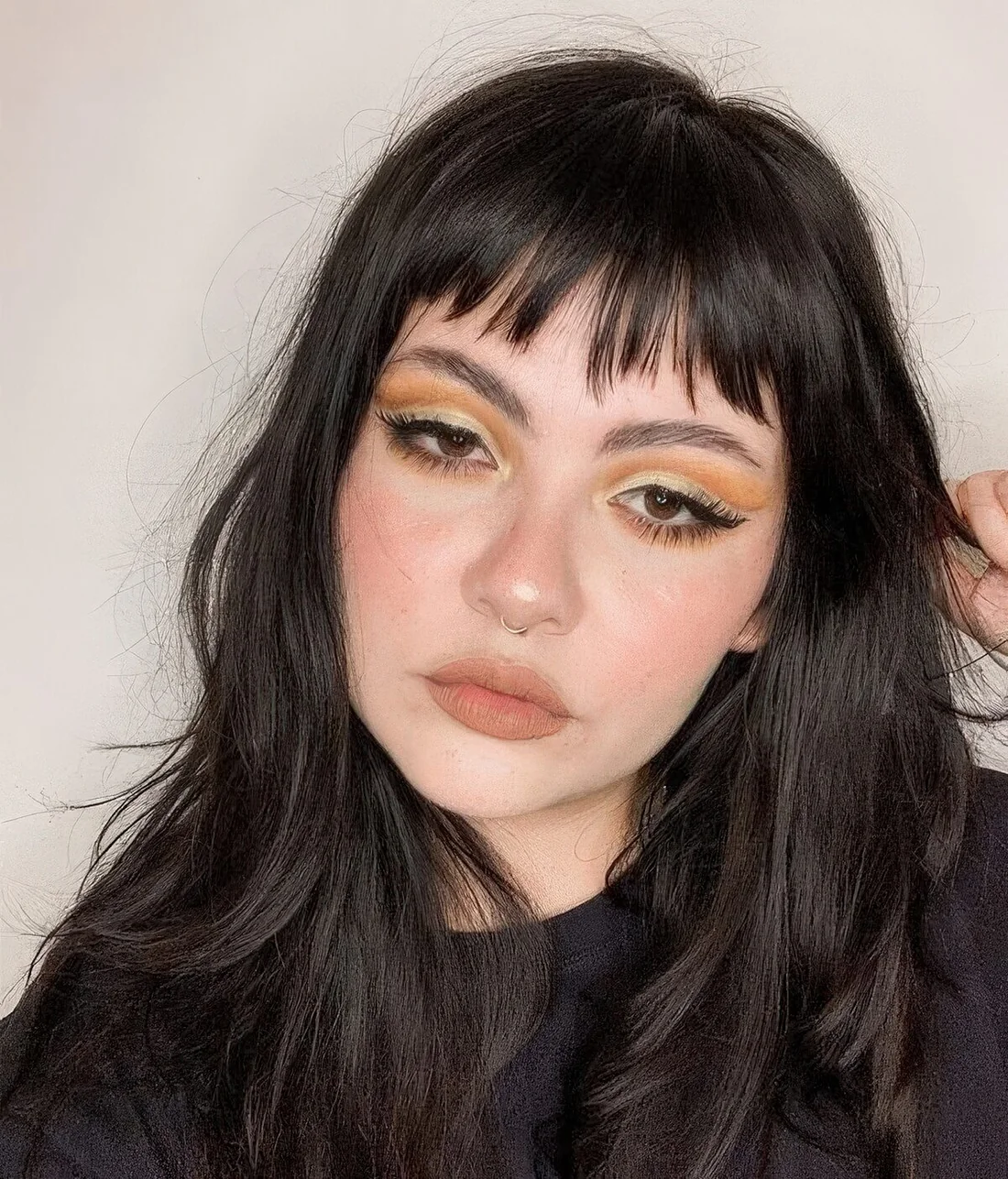 Photo showing black hair choppy bangs, with the hairstyle clearly visible.