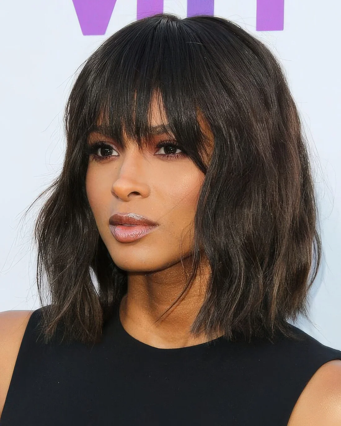 Photo showing wavy bob choppy fringe, with the hairstyle clearly visible.