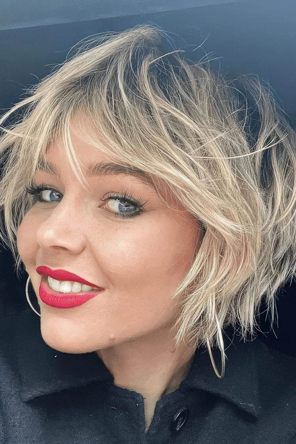 Photo showing messy blonde bob, with the hairstyle clearly visible.
