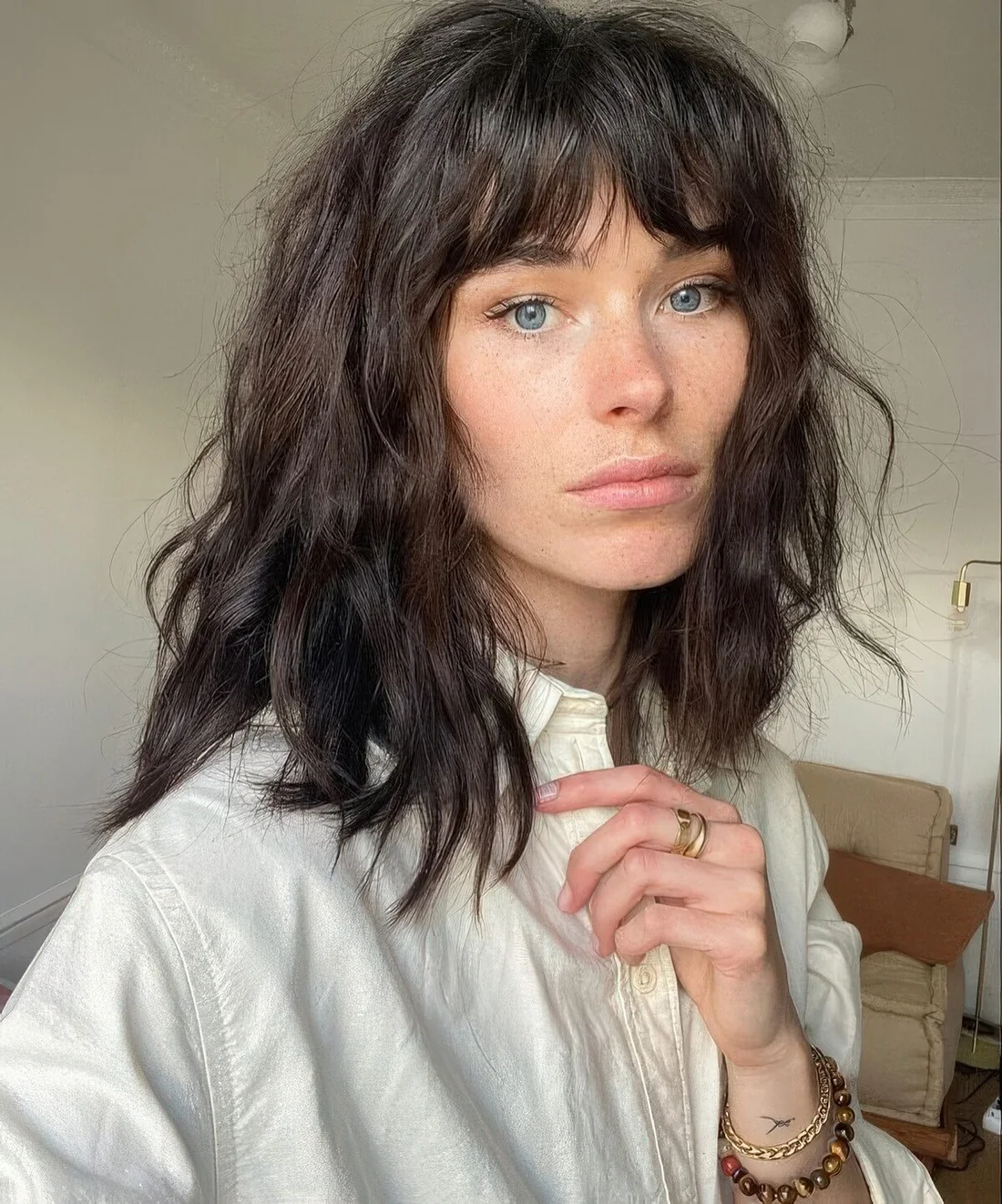Photo showing messy brown hair bangs, with the hairstyle clearly visible.