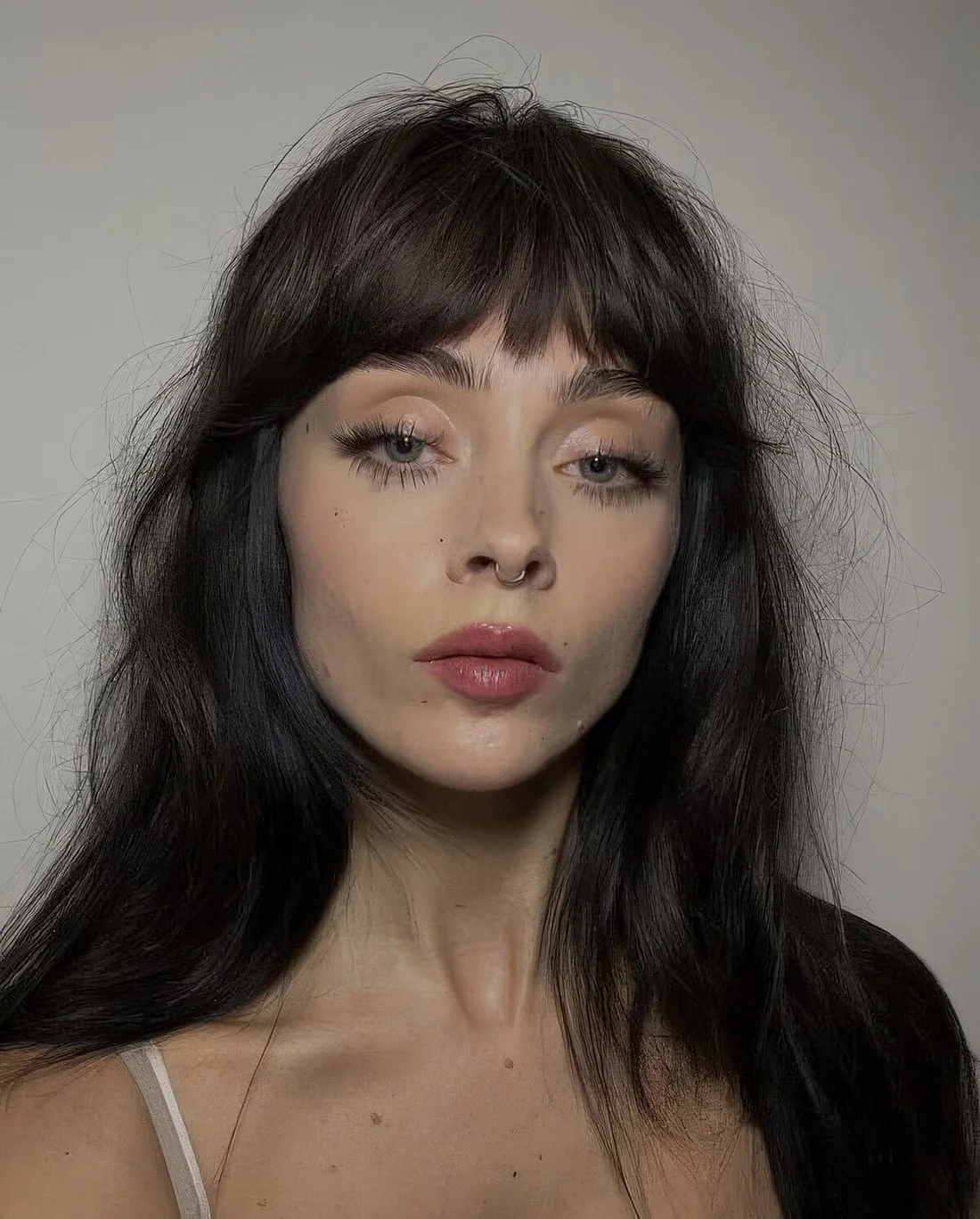 Photo showing messy hair choppy bangs, with the hairstyle clearly visible.
