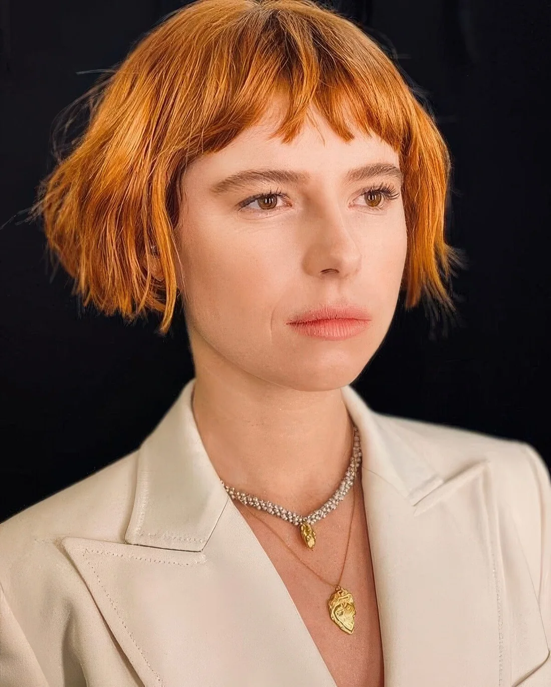 Photo showing short ginger bob, with the hairstyle clearly visible.