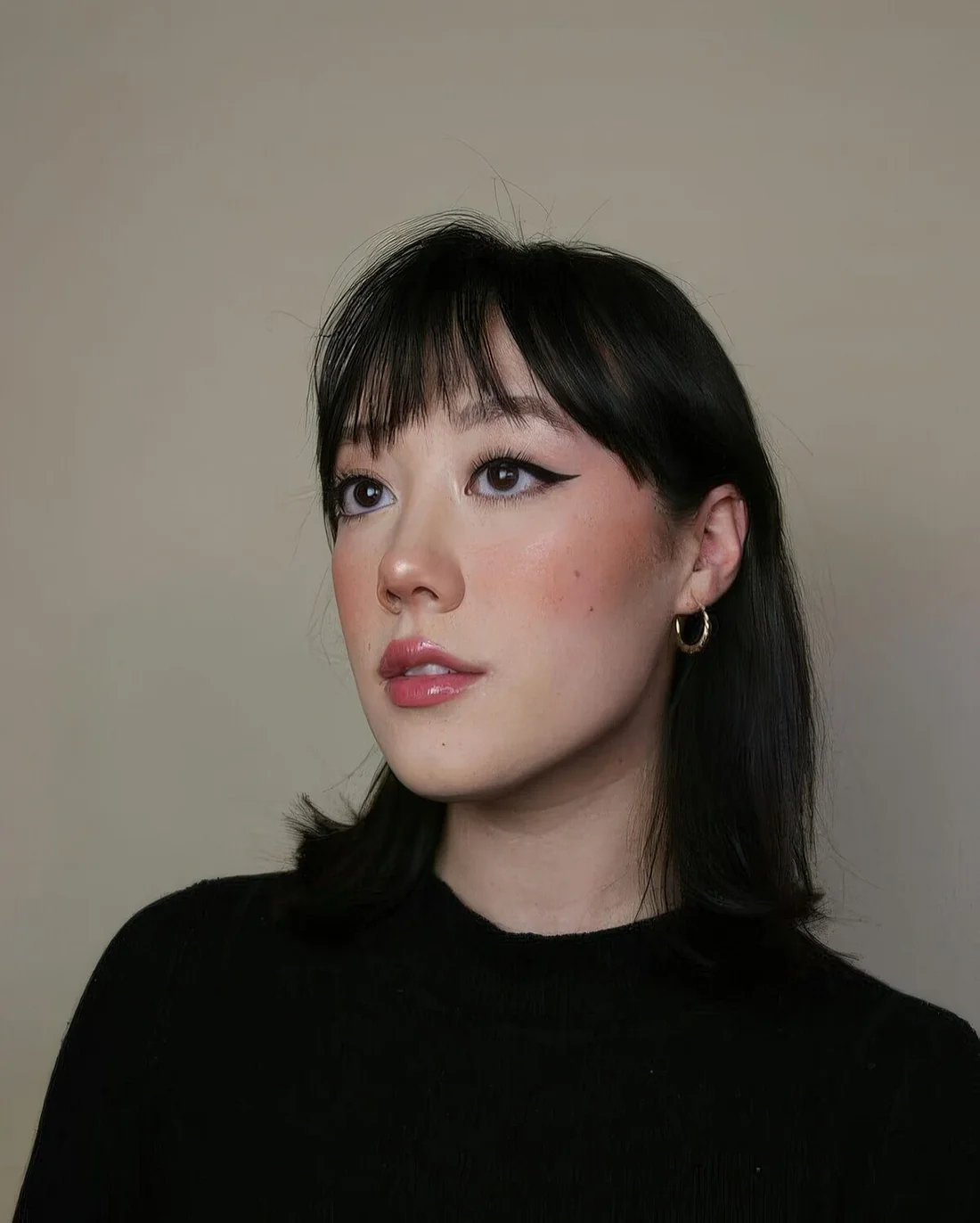Photo showing shoulder bob choppy fringe, with the hairstyle clearly visible.