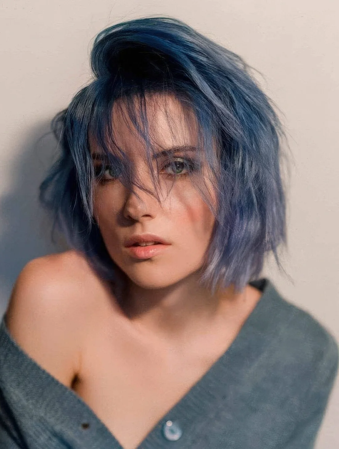 Blue choppy bob with a thick fringe accompanying your choppy layered mane or a touch of short layers that seamlessly blend with the rest of your hair.